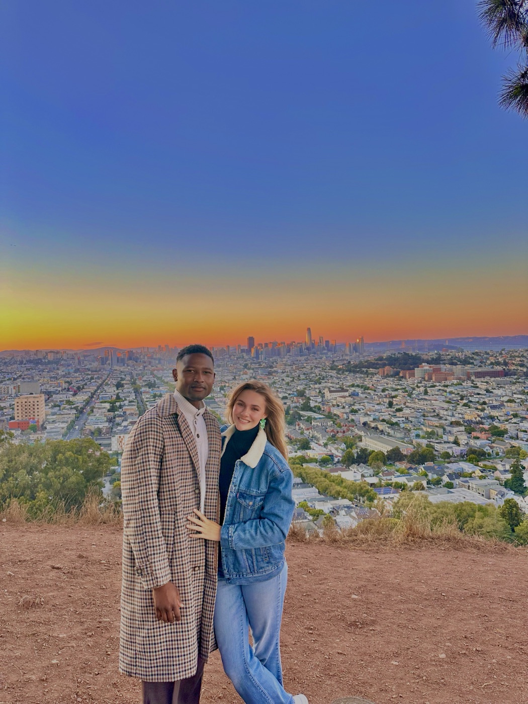 Maina and Katie — co-founders of Arewa Chin Chin — at Bernal Heights overlooking San Francisco at golden hour